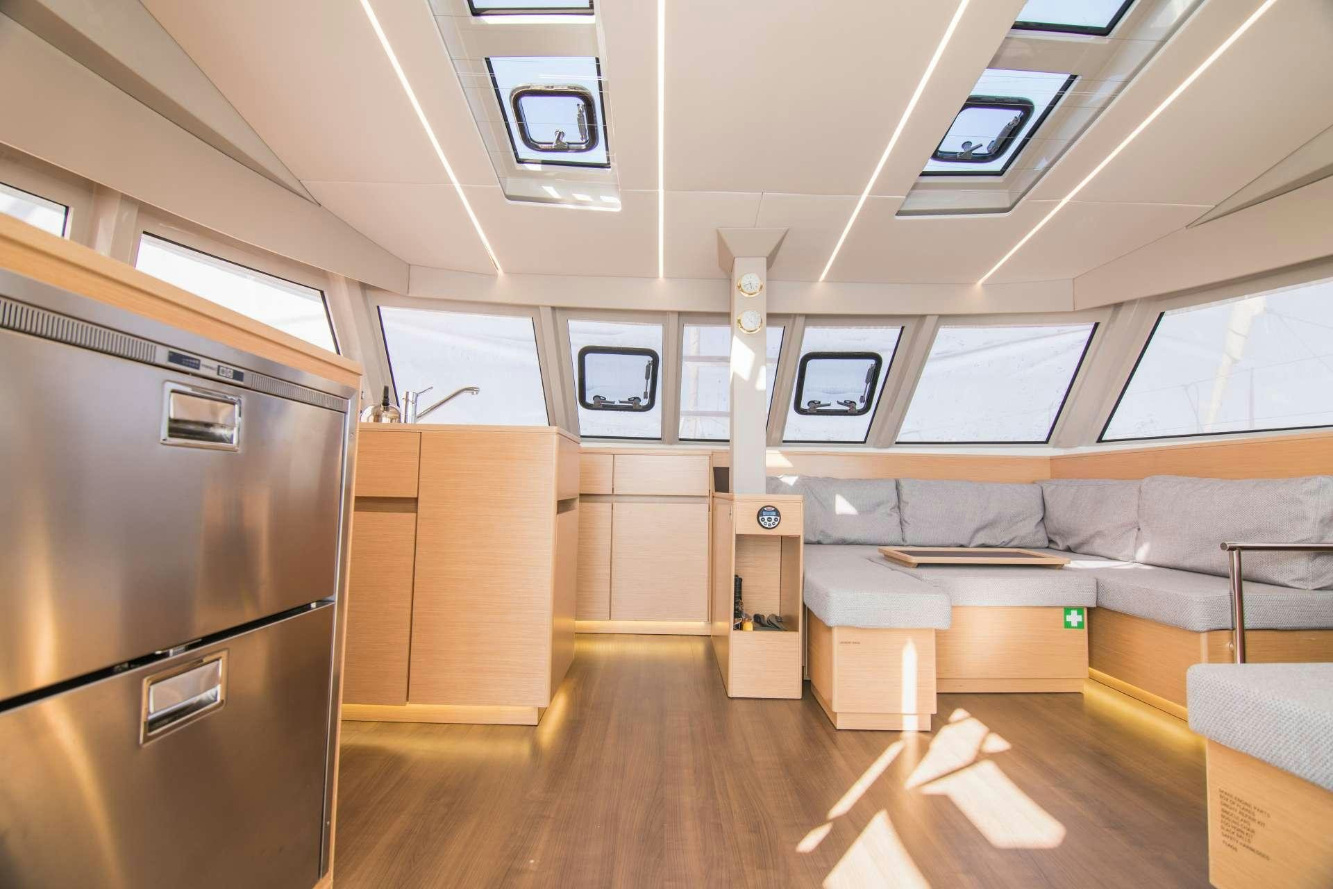 a room with a couch and a television aboard Sithonia Yacht for Charter