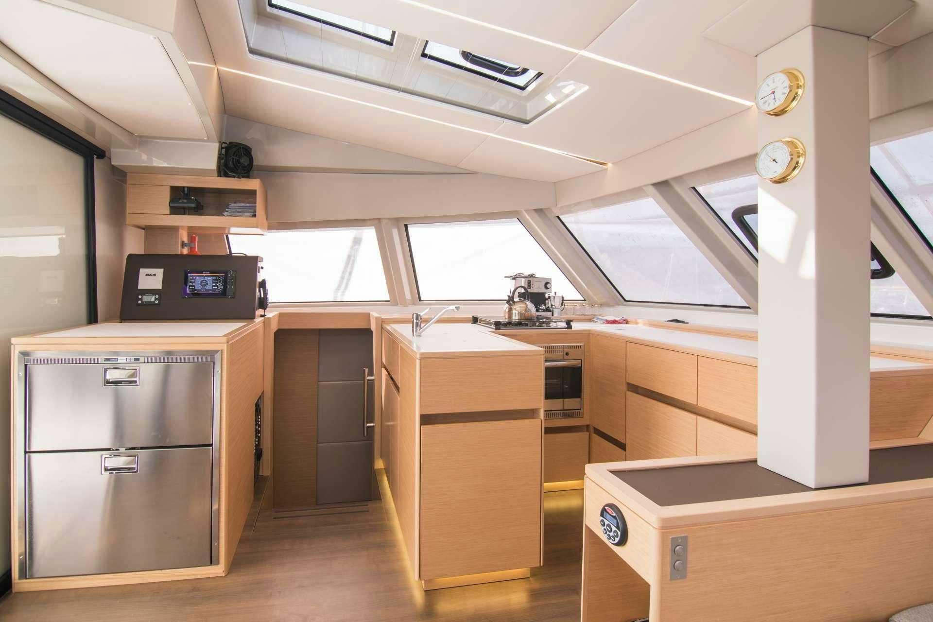 a room with many cabinets and a machine aboard Sithonia Yacht for Charter