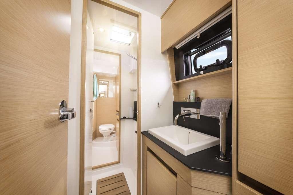 a bathroom with a sink and a mirror aboard Sithonia Yacht for Charter