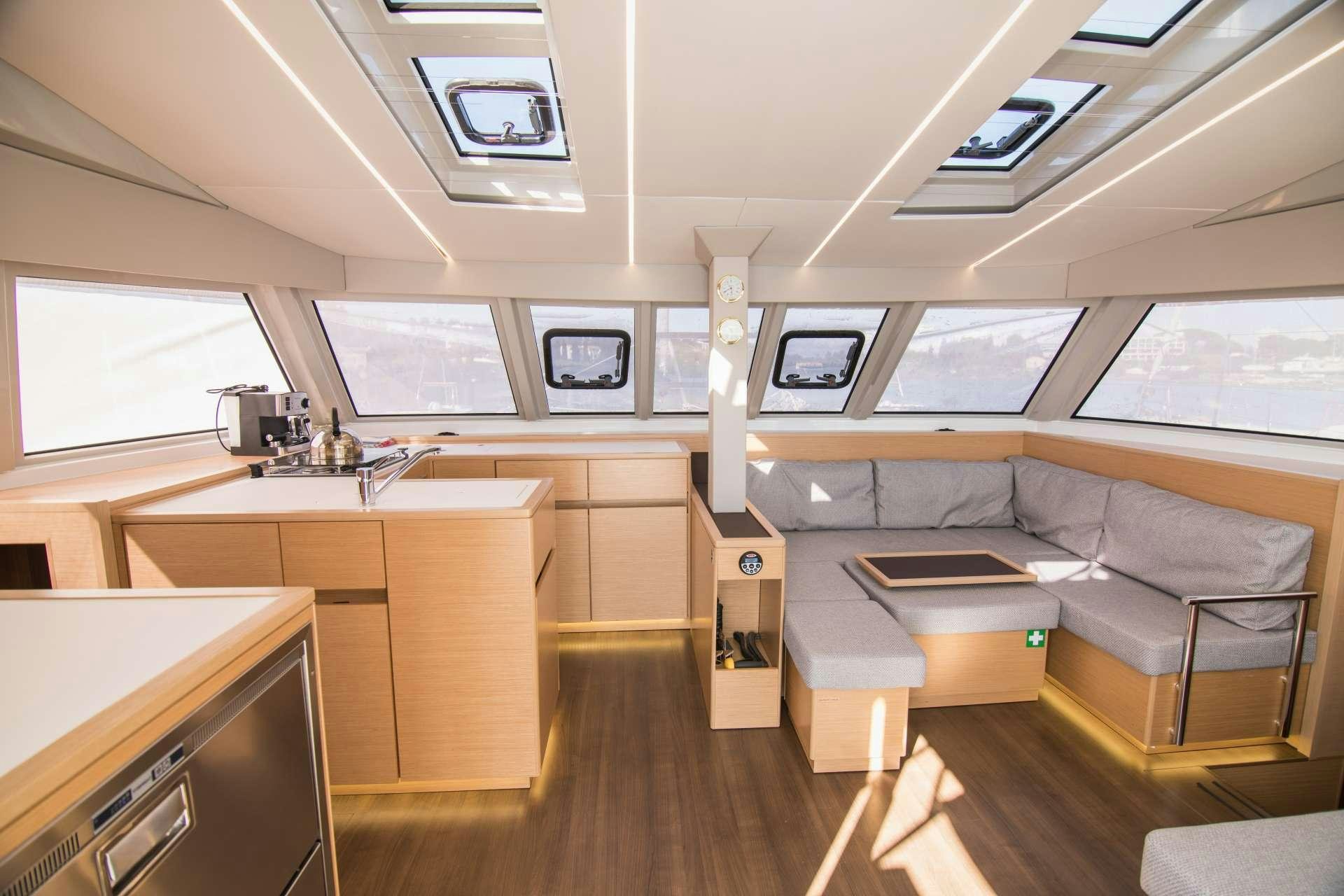 a room with a couch and a desk aboard Sithonia Yacht for Charter