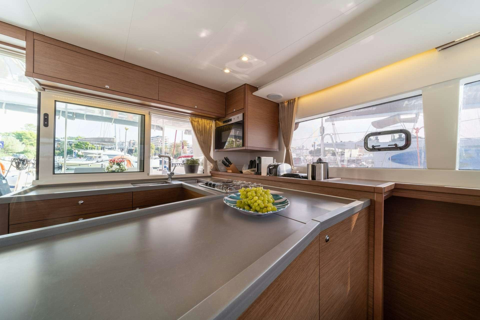 a kitchen with a bowl of food aboard SKY BLU  Yacht for Charter