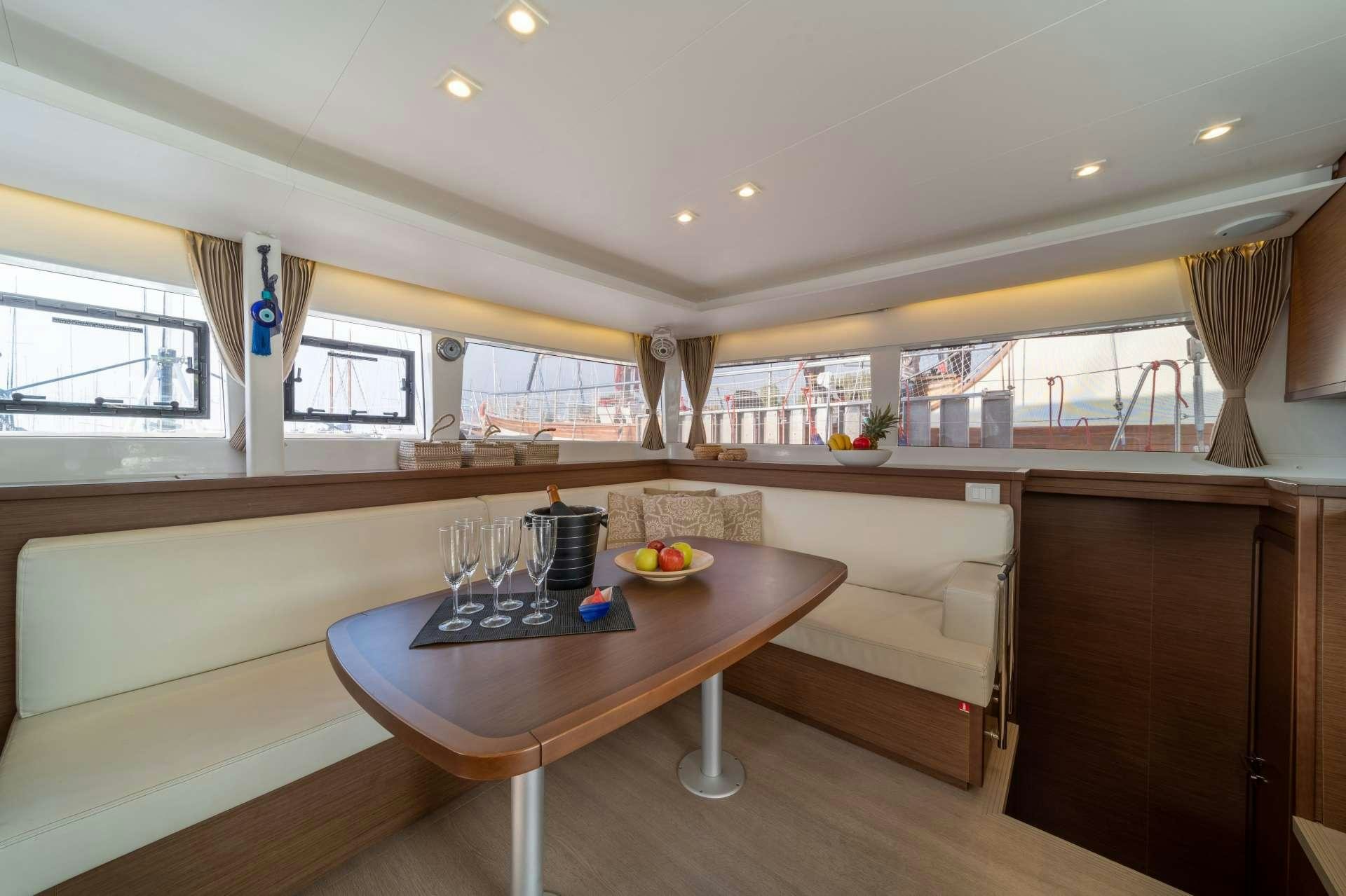 a room with a table and chairs aboard SKY BLU  Yacht for Charter