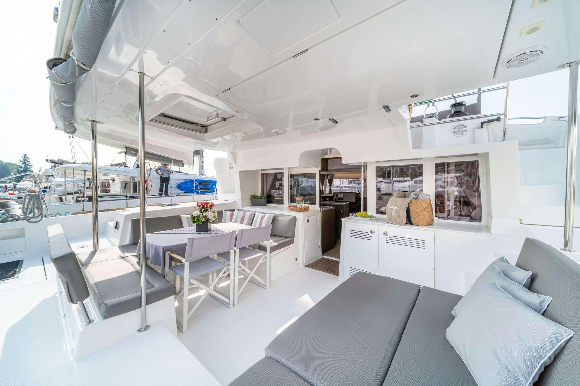 a room with a table and chairs aboard SKY BLU  Yacht for Charter