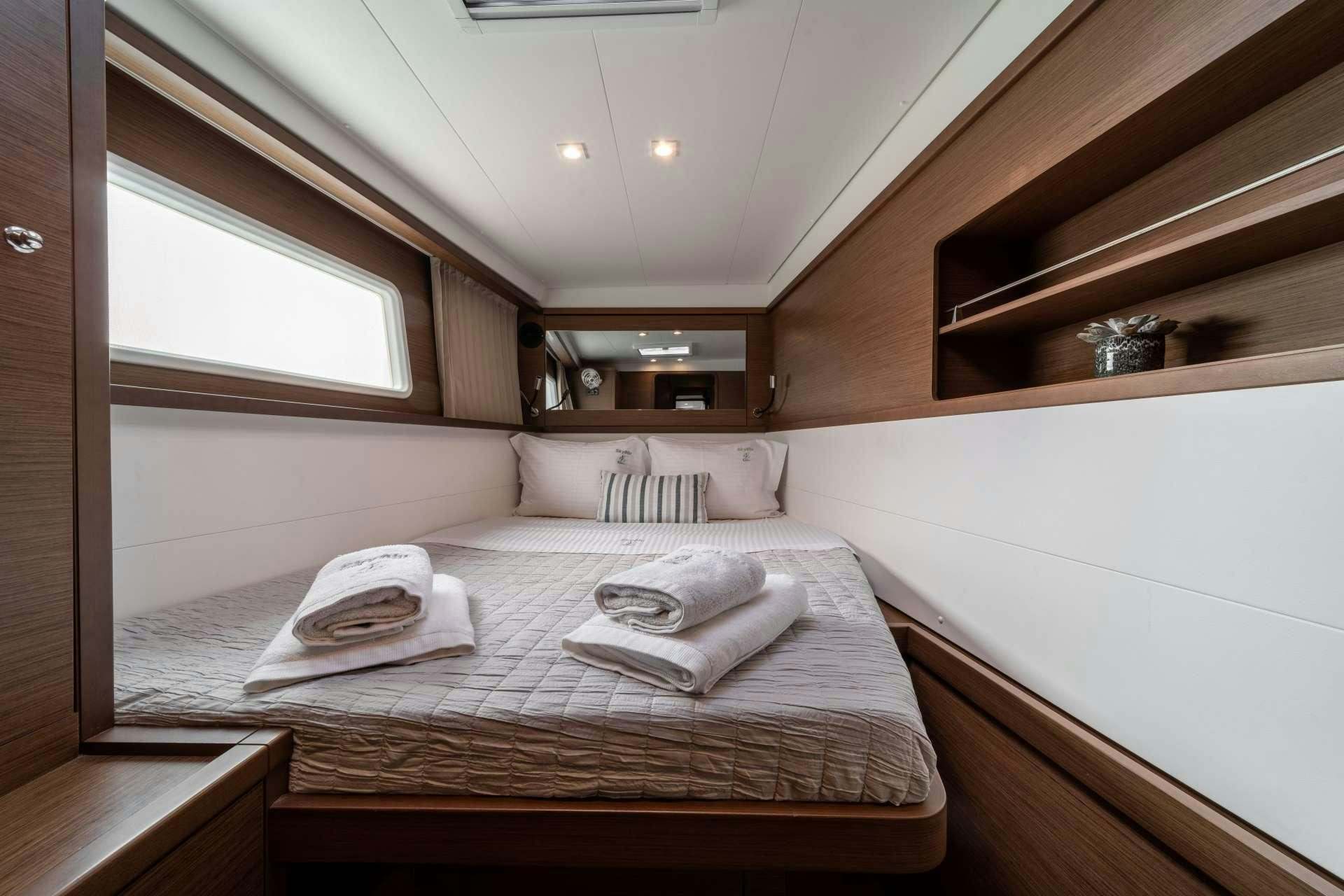 a bed in a room aboard SKY BLU  Yacht for Charter