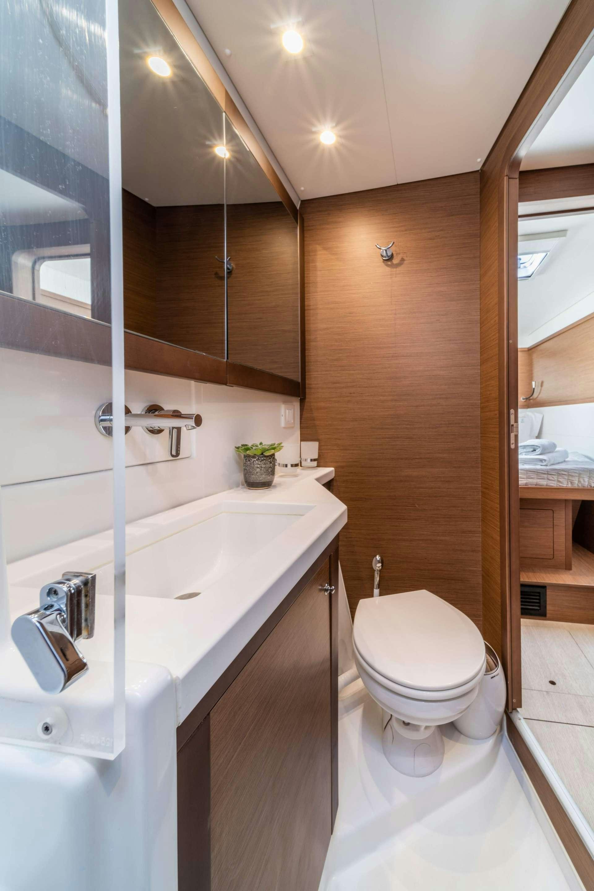 a bathroom with a toilet and sink aboard SKY BLU  Yacht for Charter