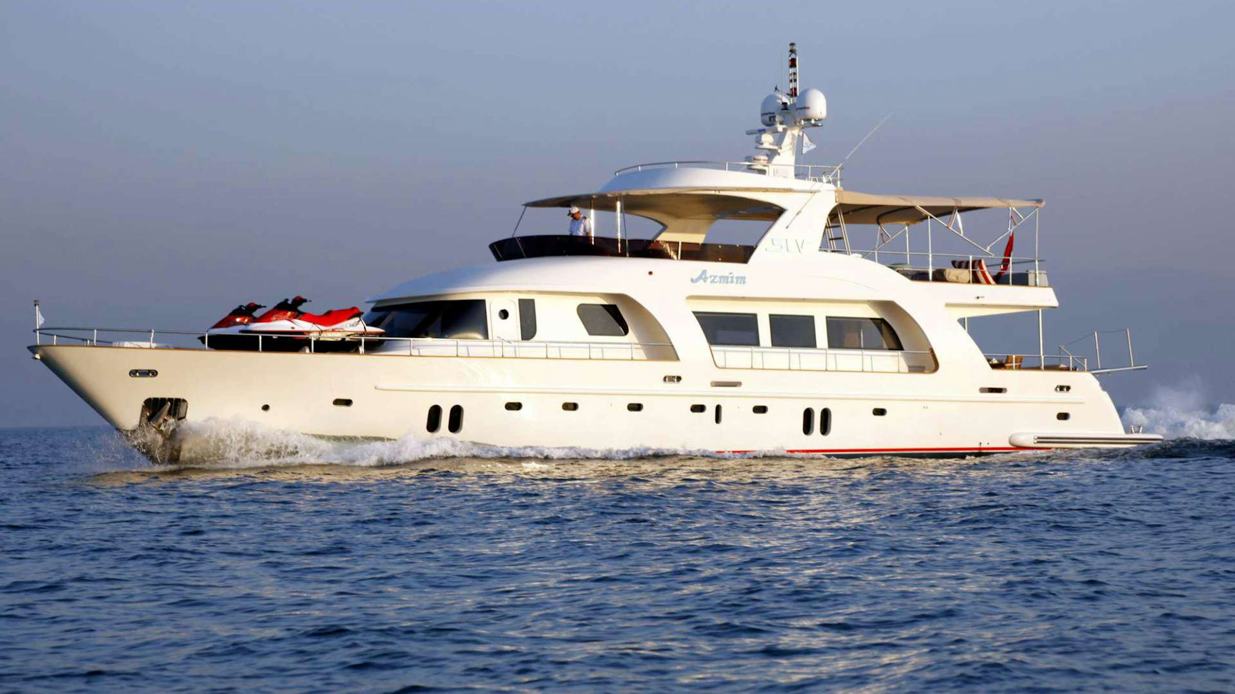 a white boat in the water aboard AZMIM Yacht for Charter