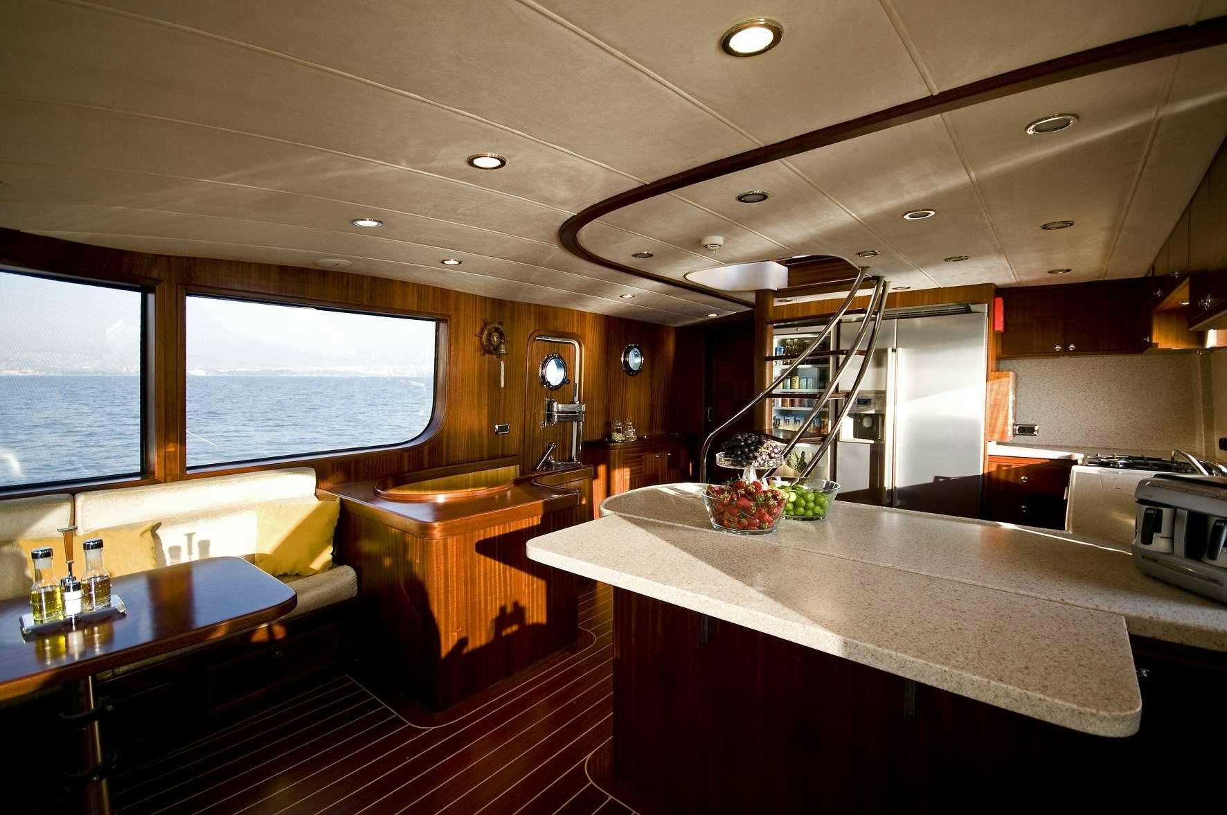 a large kitchen with a large island aboard AZMIM Yacht for Charter