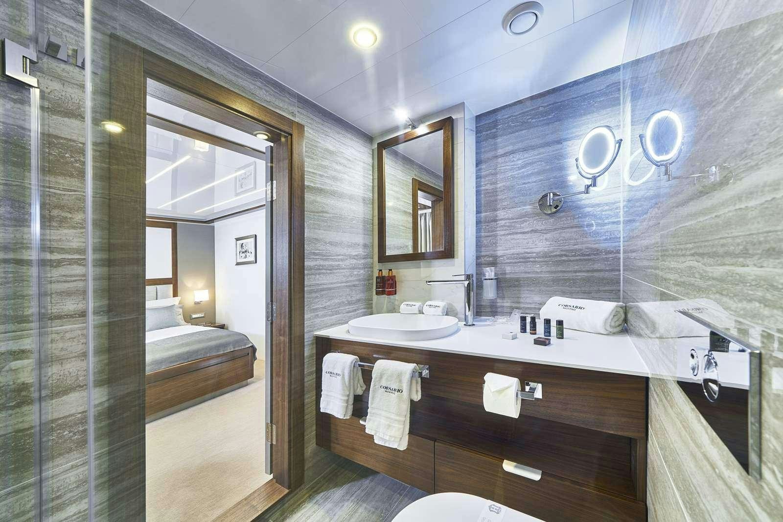 a bathroom with a large mirror aboard CORSARIO Yacht for Charter