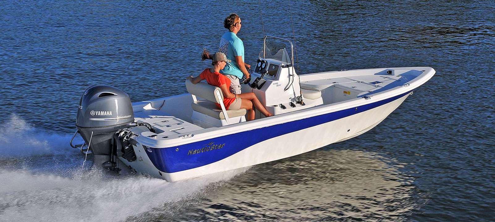 a man and a boy riding a jet ski on the water aboard ONE NET Yacht for Charter