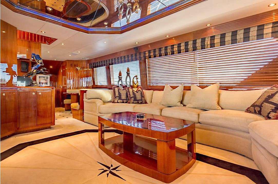 a living room with a large window aboard ONE NET Yacht for Charter