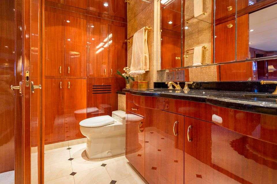 a bathroom with a toilet and a sink aboard ONE NET Yacht for Charter