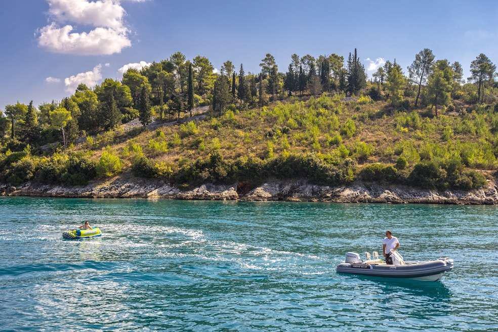 a person on a boat in the water aboard Pura Vida Yacht for Charter