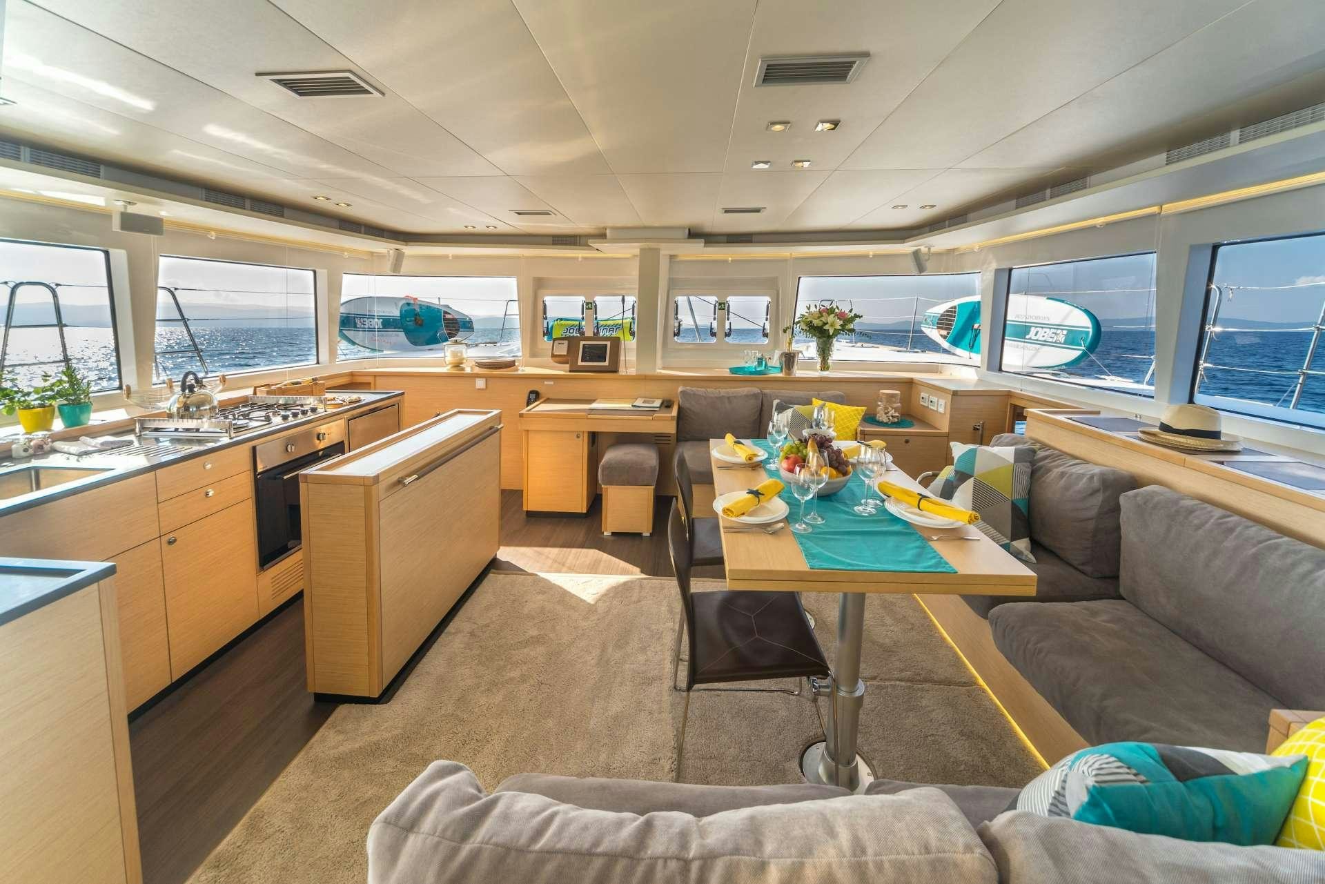 a living room with a couch and a table aboard Pura Vida Yacht for Charter