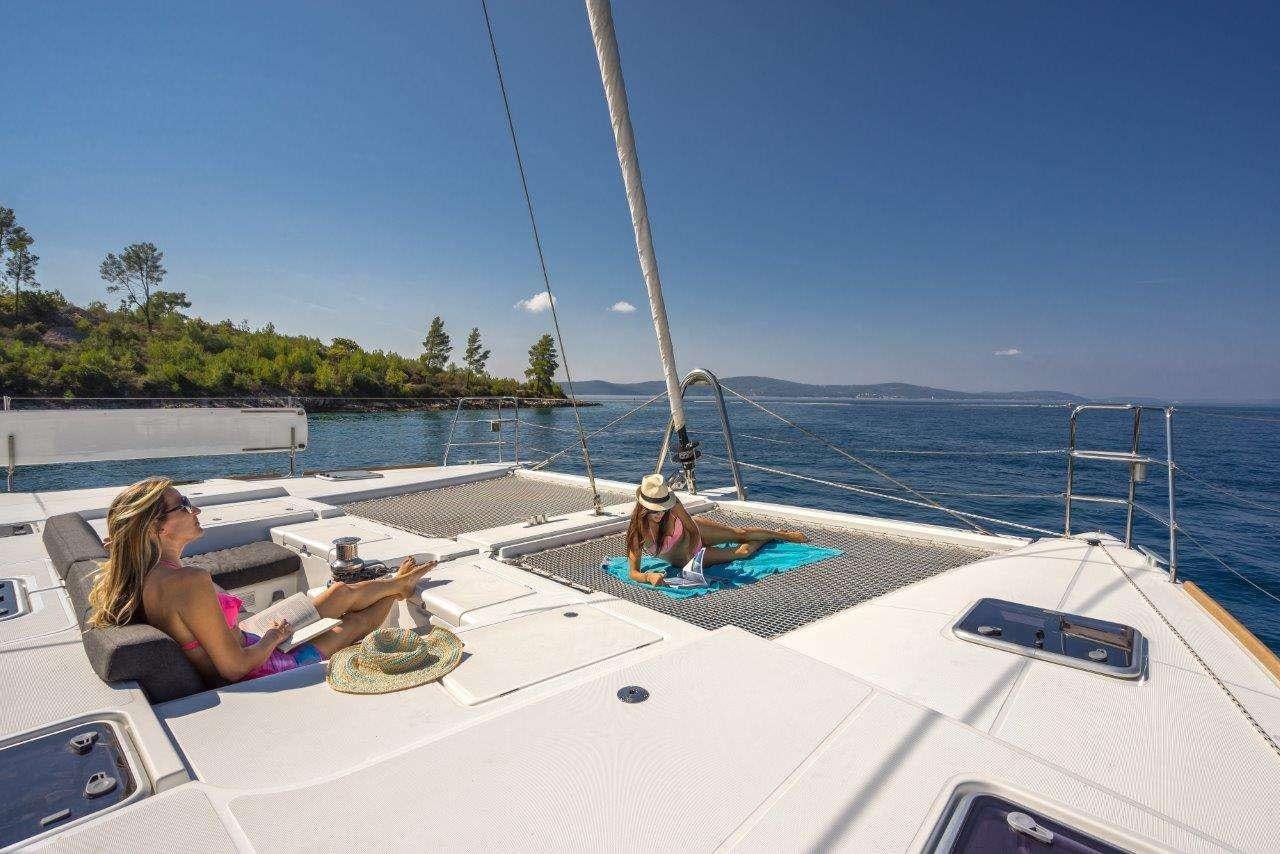 a person sitting on a boat aboard Pura Vida Yacht for Charter