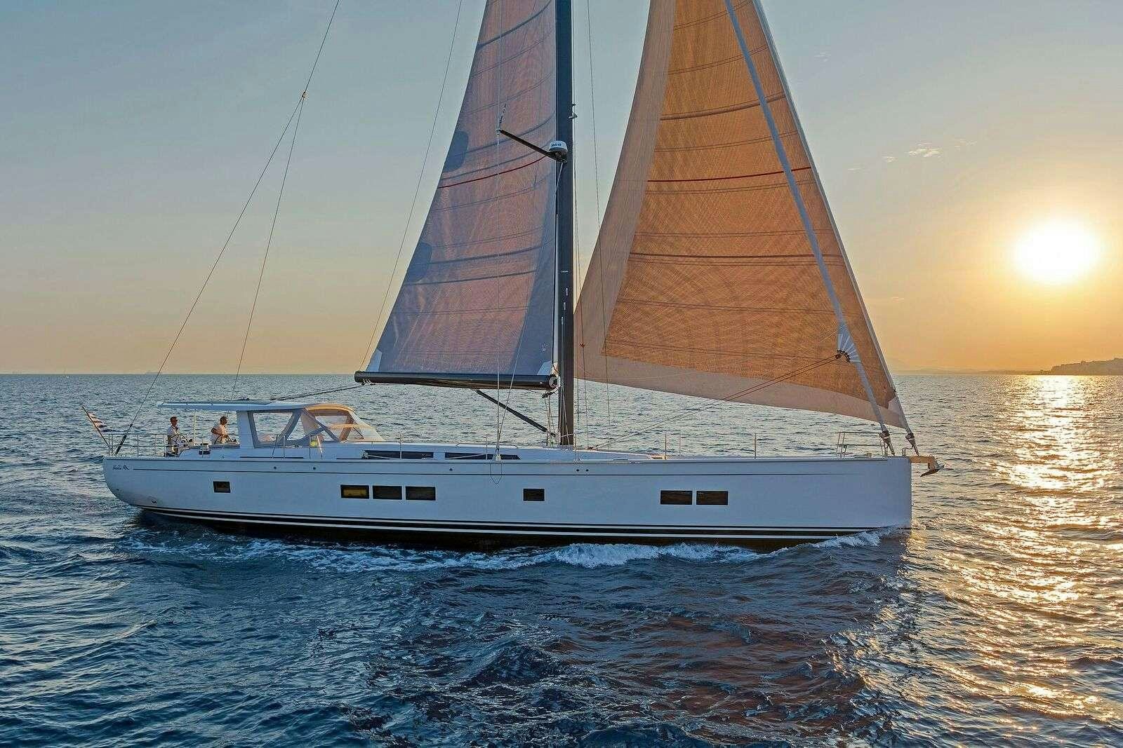 a boat sailing on the sea aboard ALIZEE Yacht for Charter