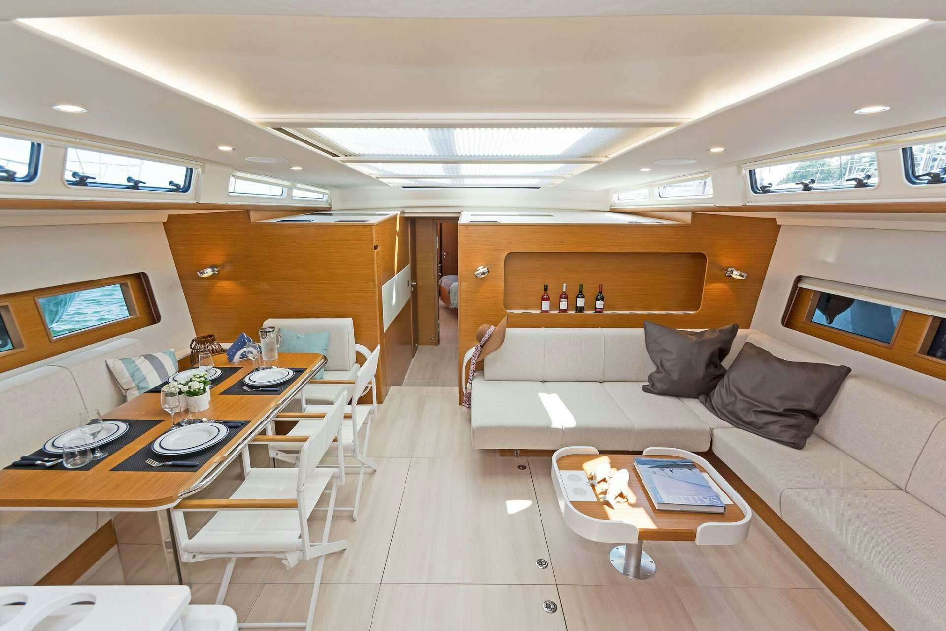 a room with a couch and a table aboard ALIZEE Yacht for Charter