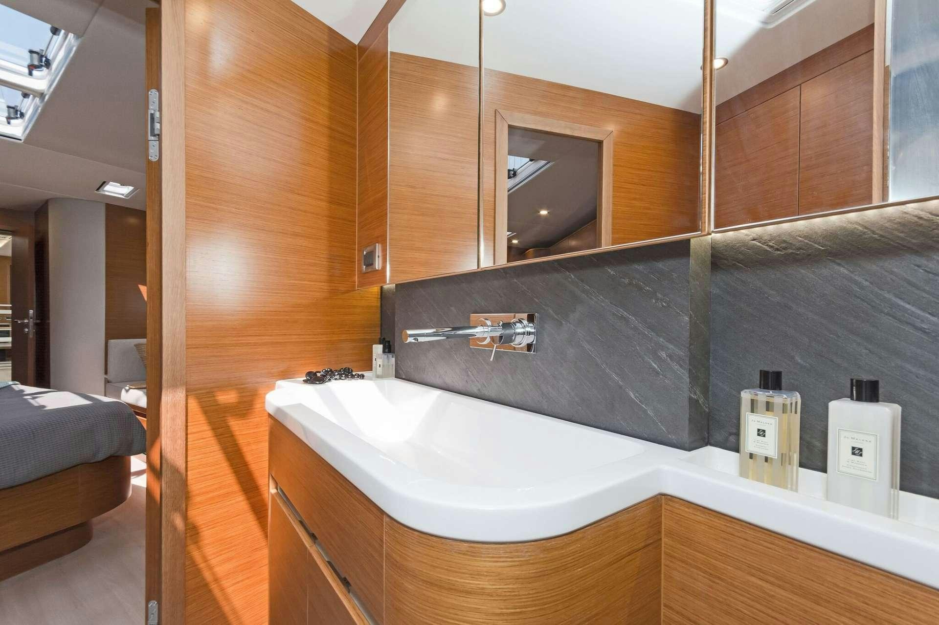a bathroom with a large bathtub aboard ALIZEE Yacht for Charter