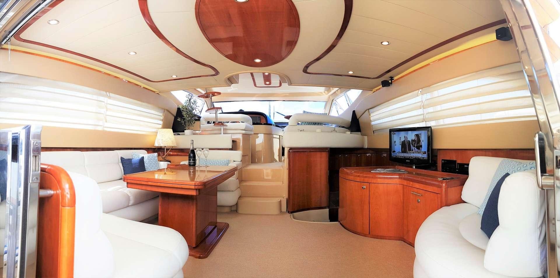 a room with a bed and a desk aboard ESPERANCE III Yacht for Charter