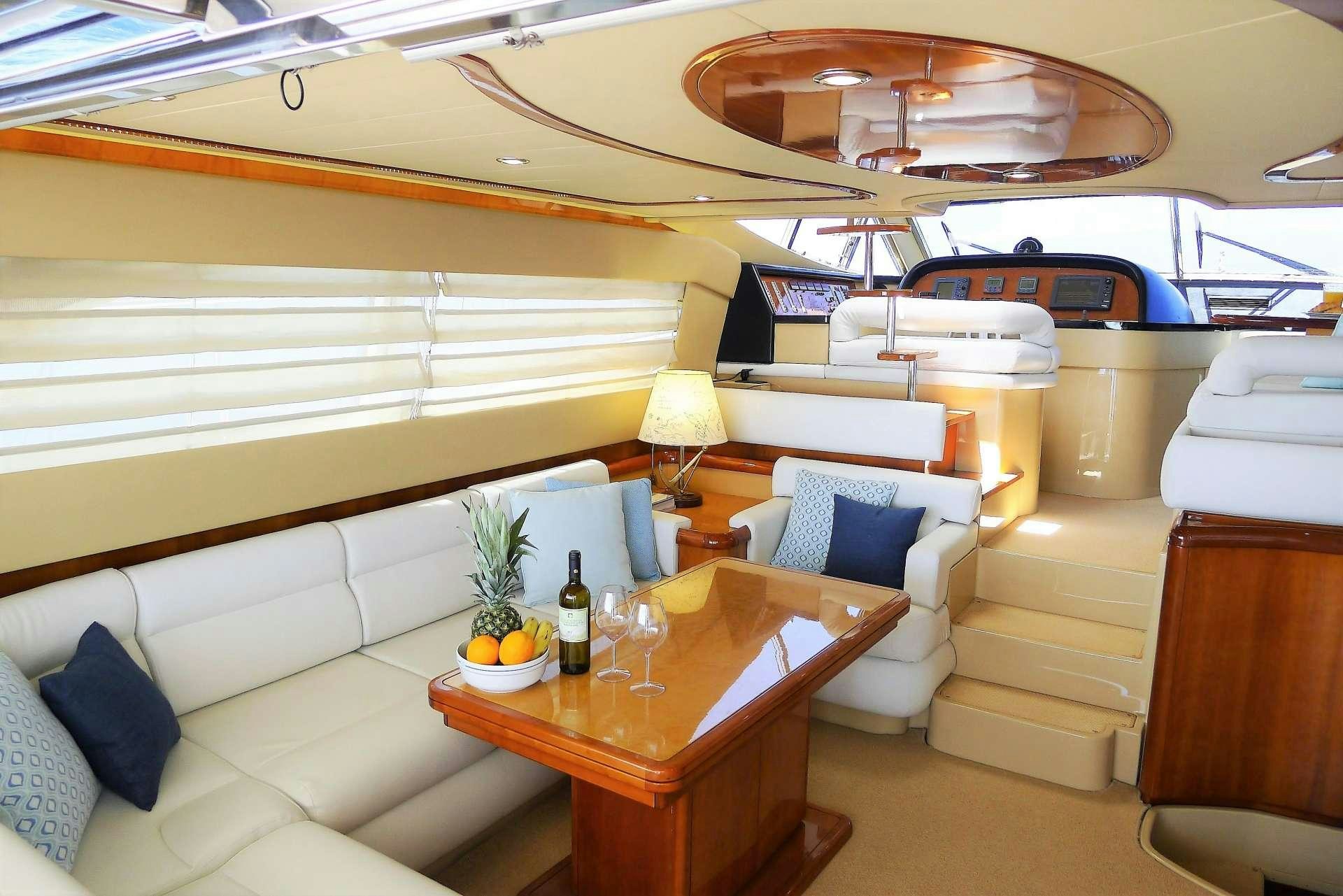 a room with a bed and a table aboard ESPERANCE III Yacht for Charter