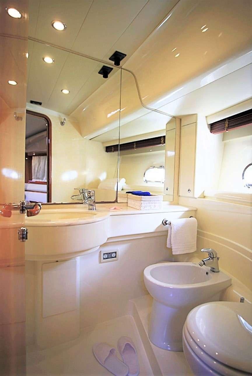 a bathroom with a sink and toilet aboard ESPERANCE III Yacht for Charter