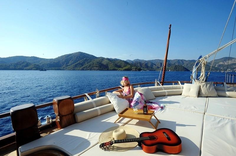 a person sitting on a boat aboard KAPTAN KADIR Yacht for Charter