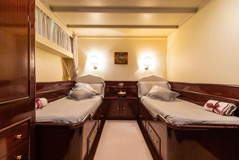 a room with two beds aboard DP MONITOR Yacht for Charter