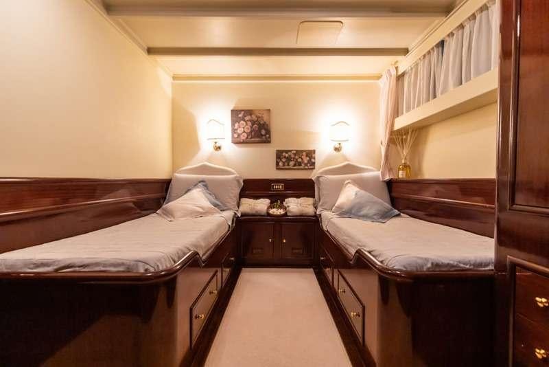 a room with two beds aboard DP MONITOR Yacht for Charter
