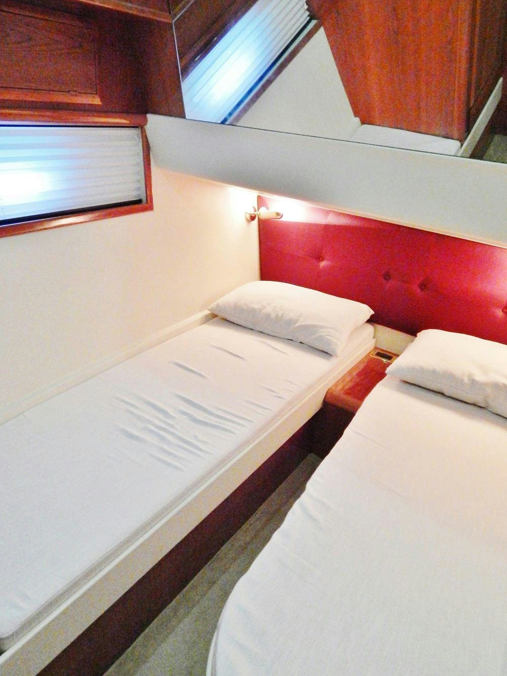 a room with two beds aboard SHINE Yacht for Charter