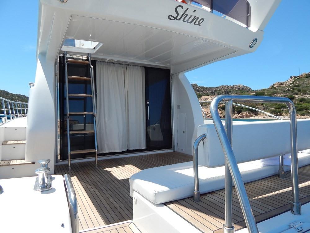 a boat on a deck aboard SHINE Yacht for Charter