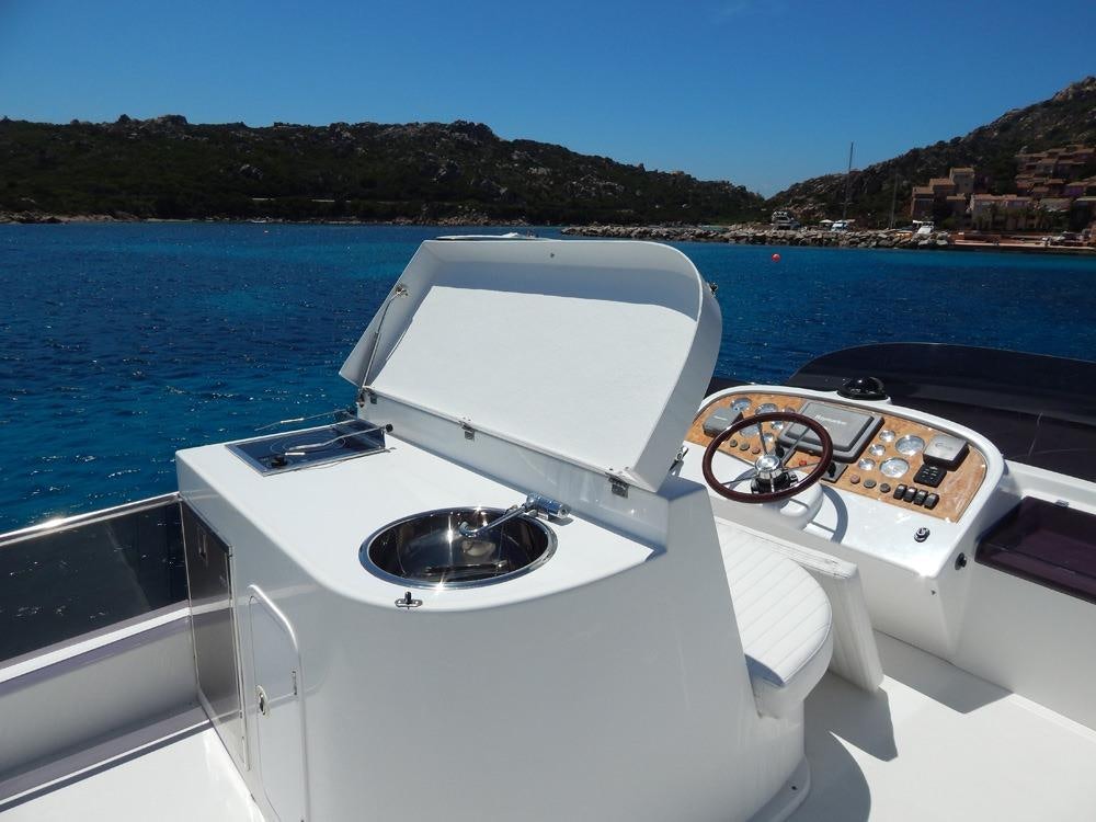 a boat with a key chain on the front aboard SHINE Yacht for Charter