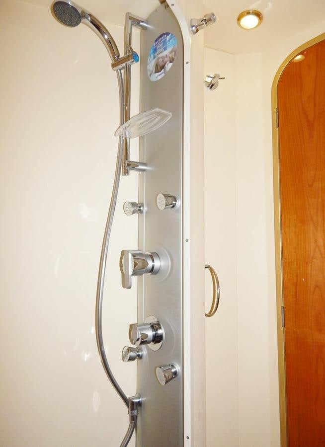 a shower with a glass door aboard SHINE Yacht for Charter