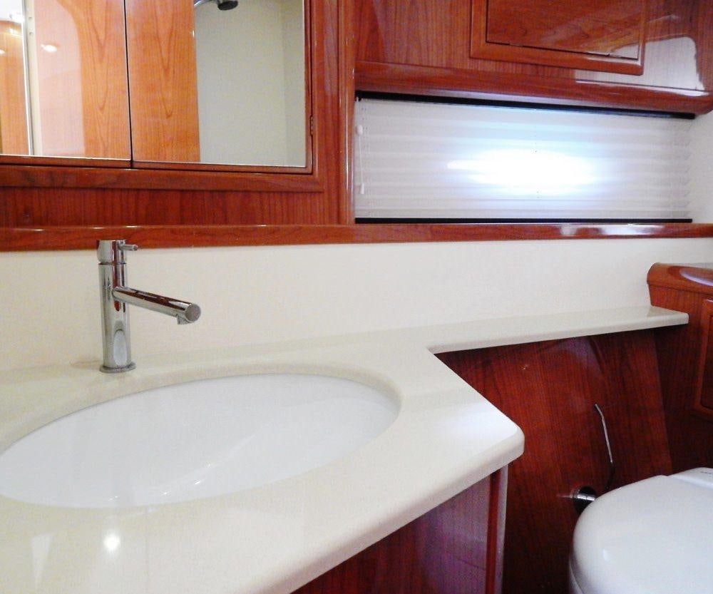 a bathroom with a sink and a toilet aboard SHINE Yacht for Charter