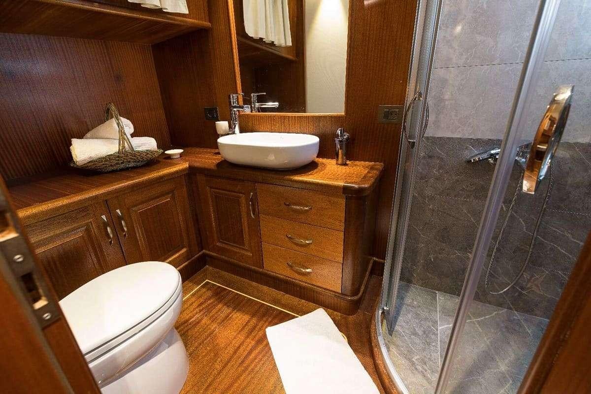 a bathroom with a sink and a shower aboard VISTA MARE Yacht for Charter