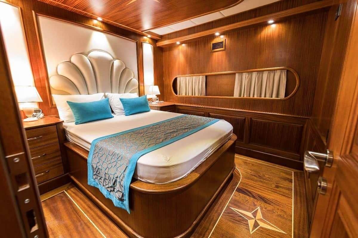 a bed in a room aboard VISTA MARE Yacht for Charter