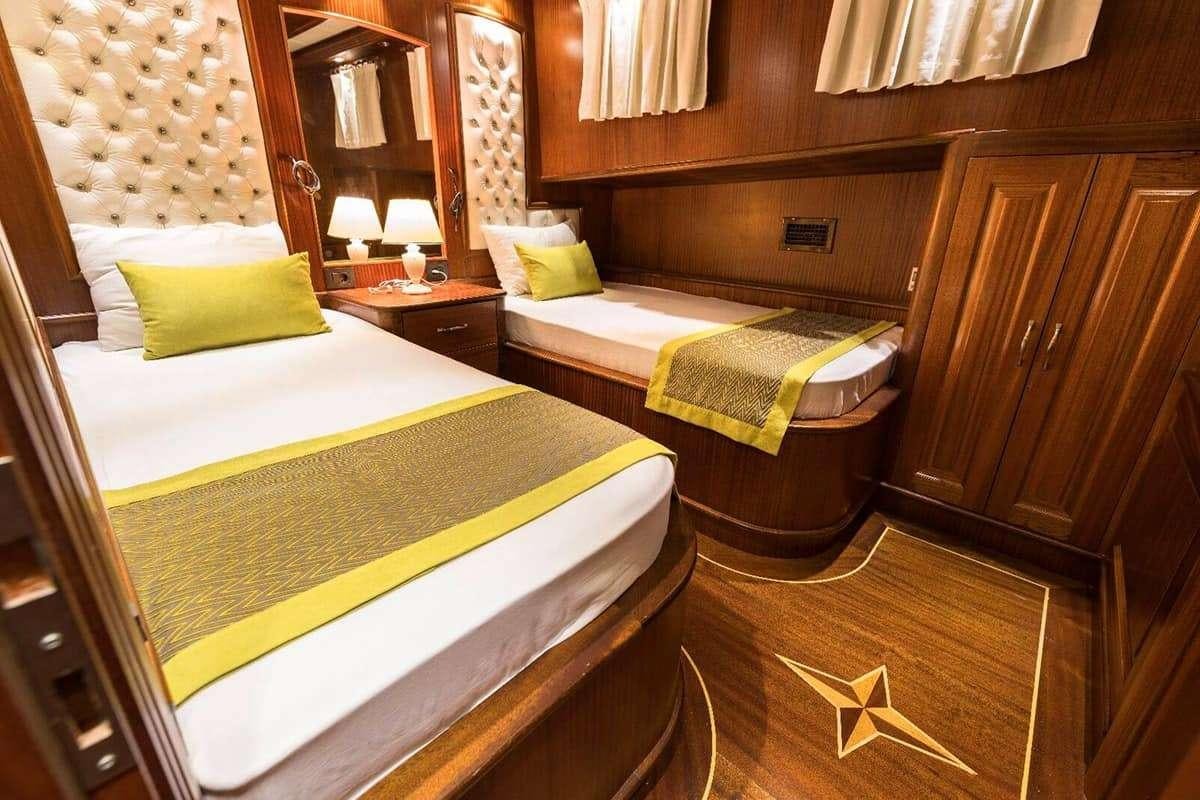 a room with two beds aboard VISTA MARE Yacht for Charter
