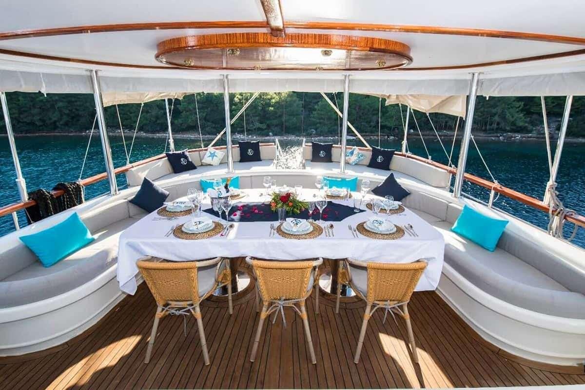 a table set for a meal on a boat aboard VISTA MARE Yacht for Charter