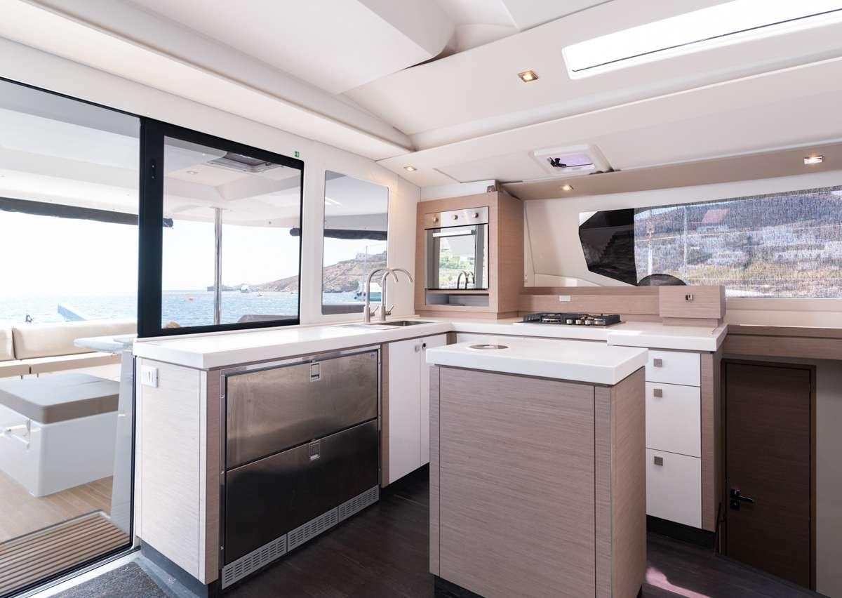 a kitchen with a stove and a sink aboard WHITE CORAL Yacht for Charter