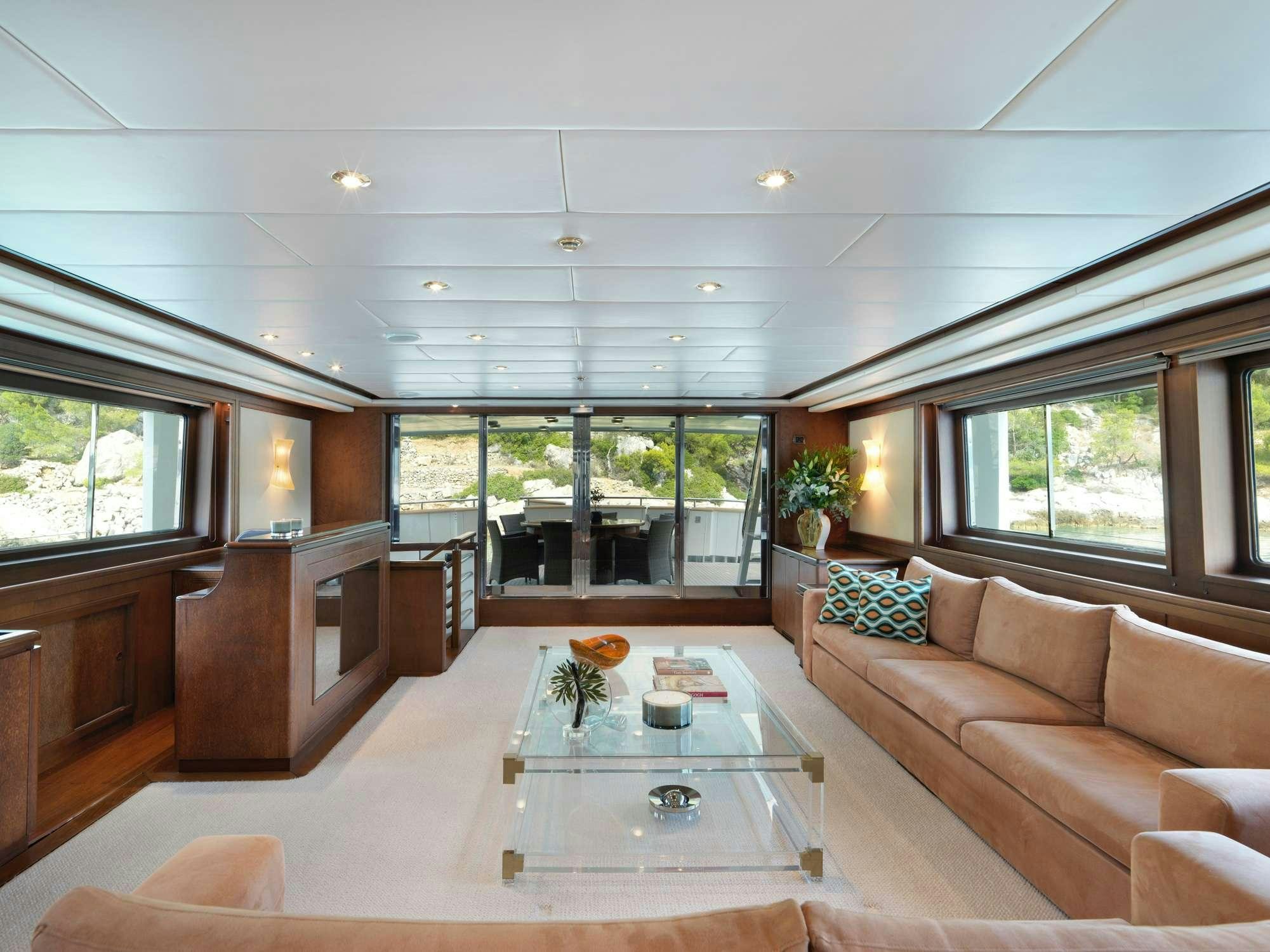 a living room with a large open window aboard IDYLLE Yacht for Charter
