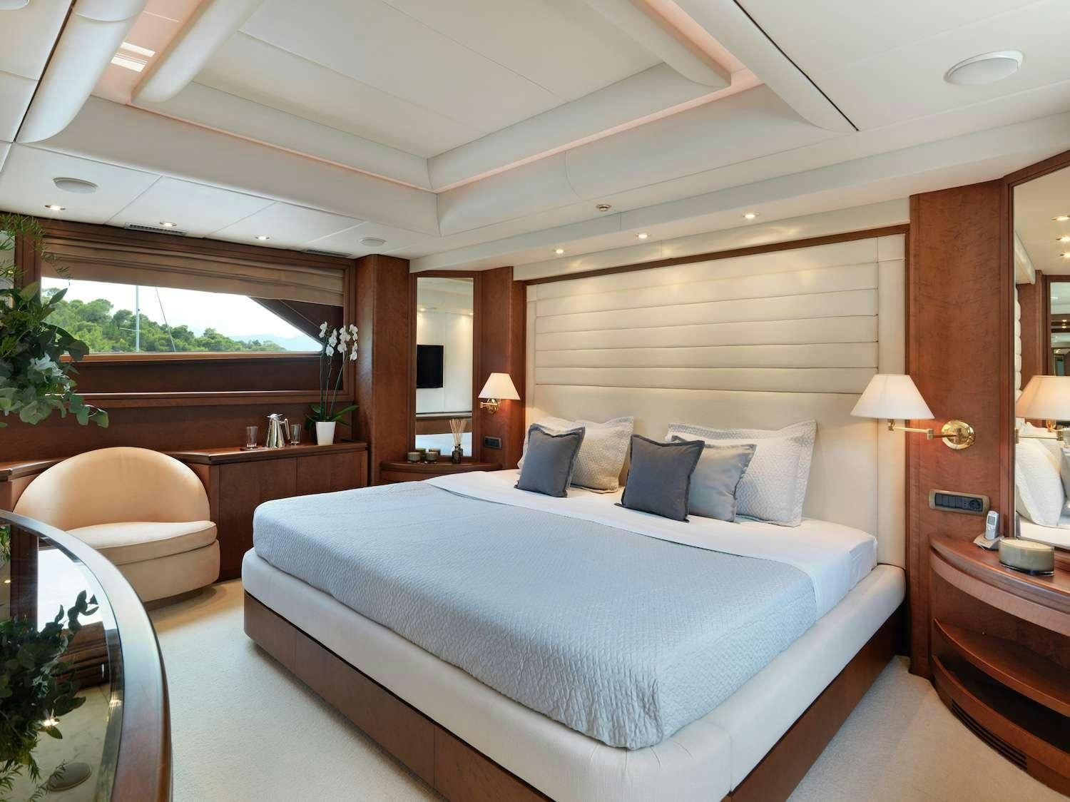 a large bed in a hotel room aboard IDYLLE Yacht for Charter