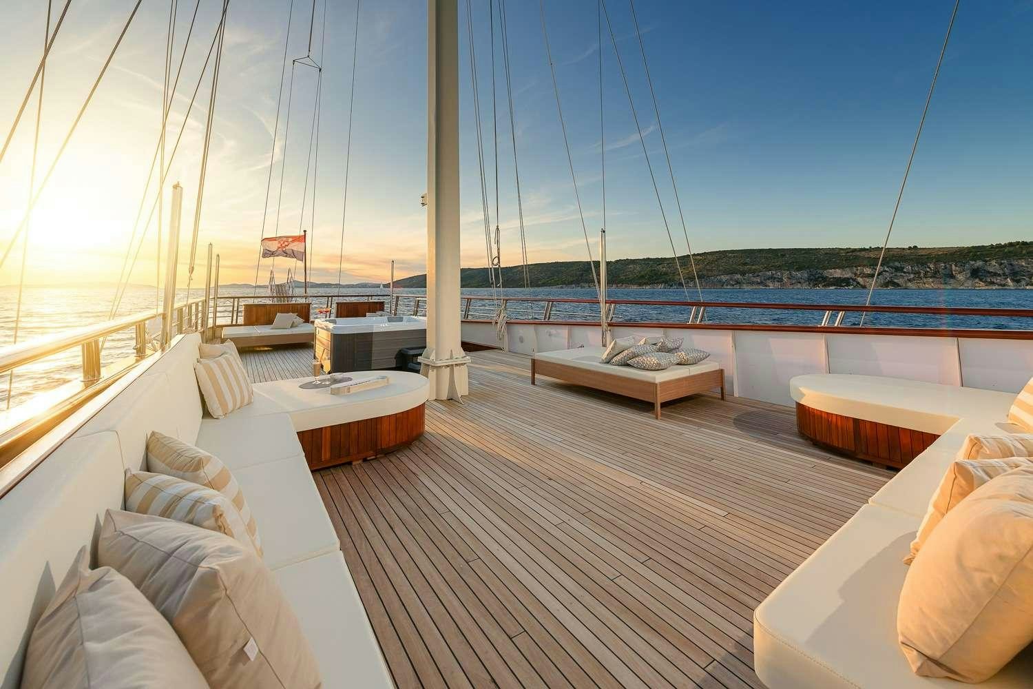 a deck with a view of the ocean and the deck aboard SON DE MAR Yacht for Charter