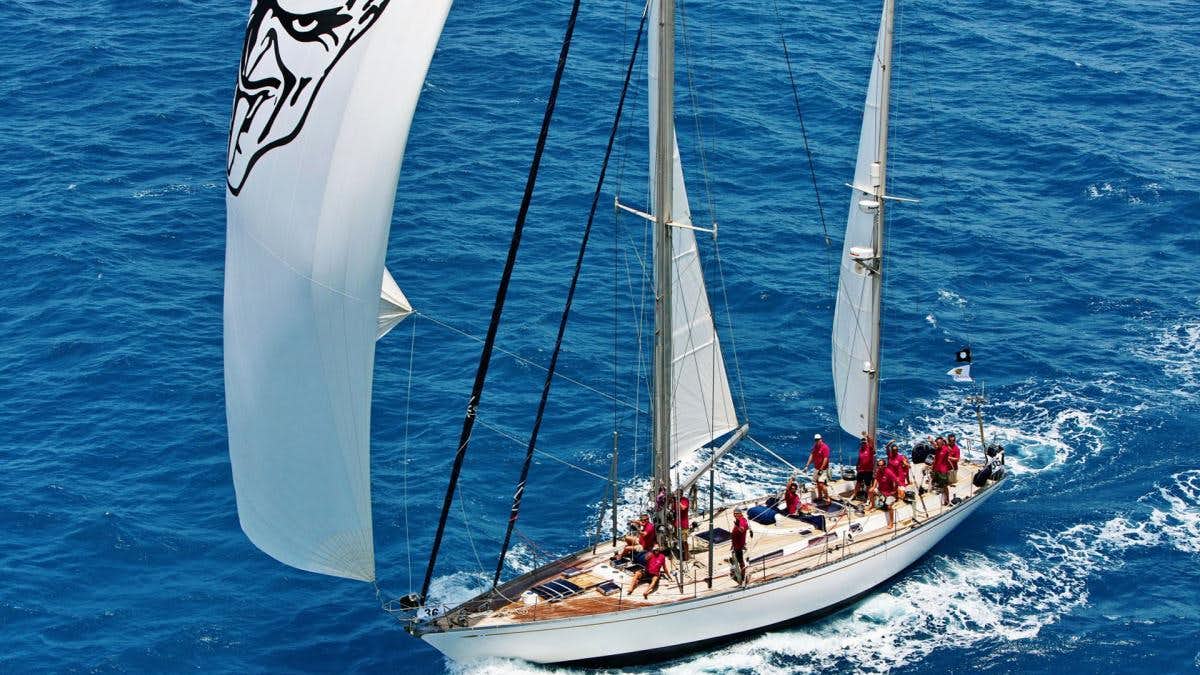a group of people sailing on a boat aboard SHAITAN (65' SWAN) Yacht for Charter