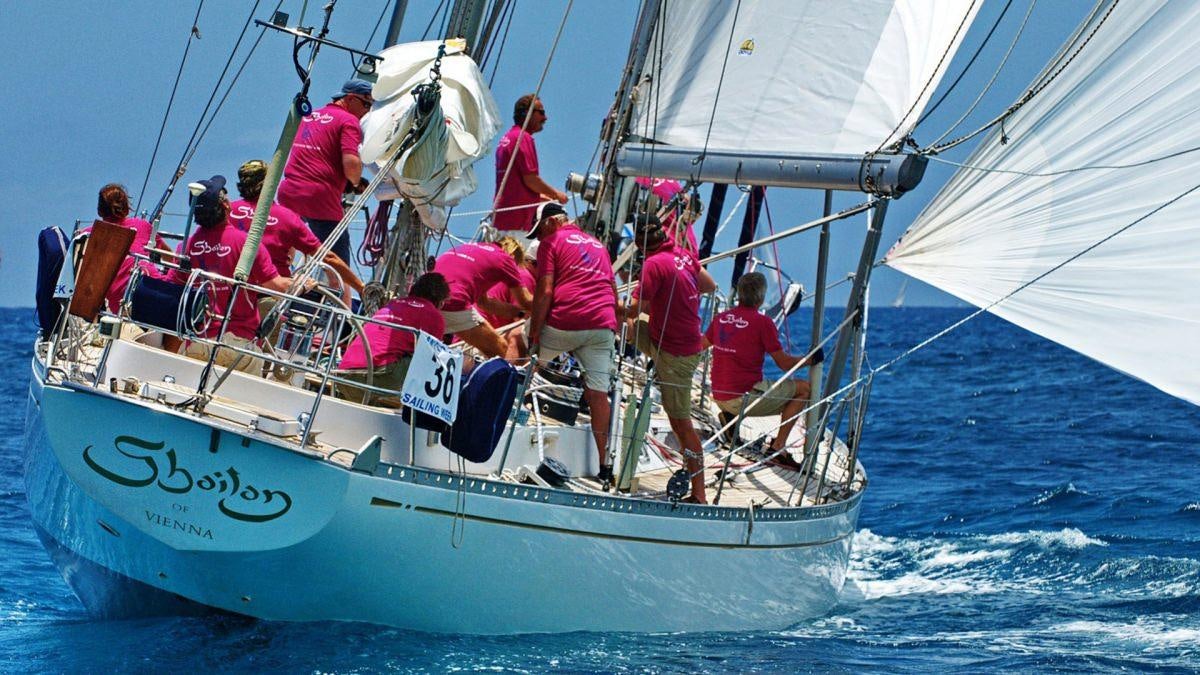 a group of people on a sailboat aboard SHAITAN (65' SWAN) Yacht for Charter