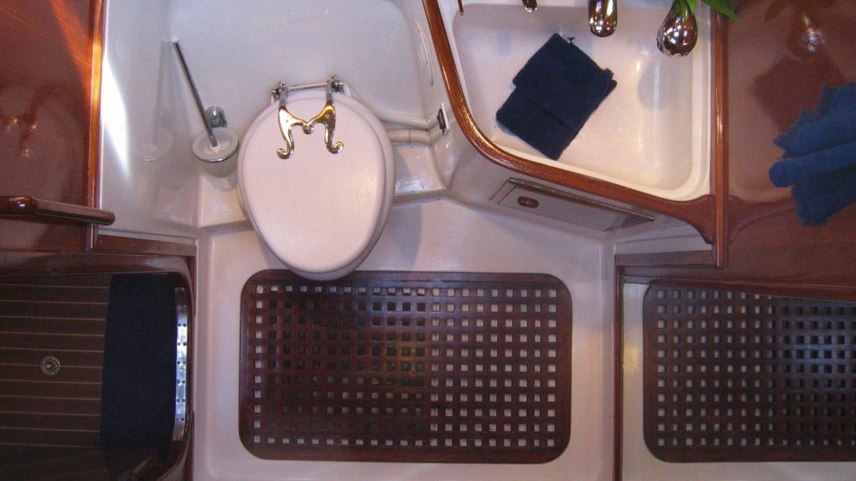 a sink and a mirror in a bathroom aboard SHAITAN (65' SWAN) Yacht for Charter