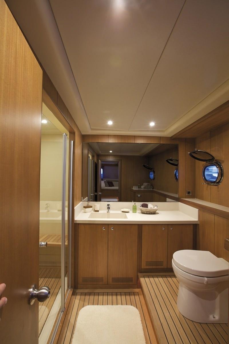 a bathroom with a sink and toilet aboard MISS B Yacht for Charter
