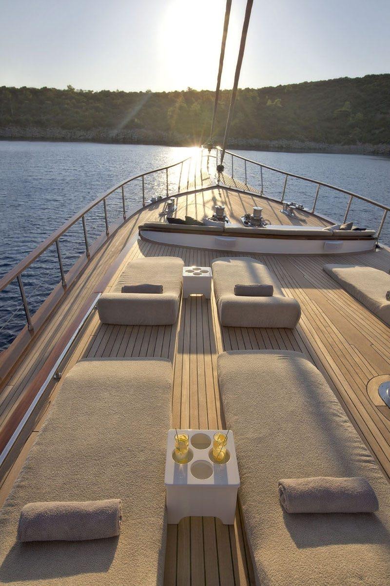 a deck with a boat on it aboard MISS B Yacht for Charter