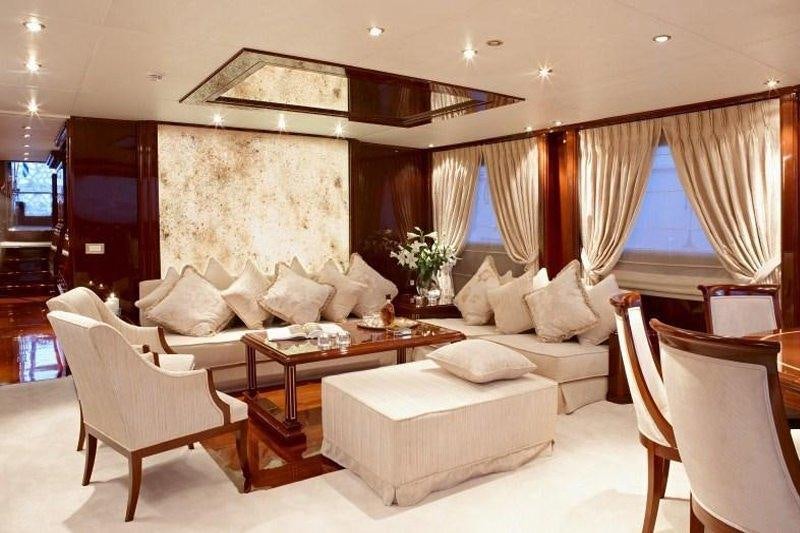 a living room with a couch and a coffee table aboard IRAKLIS L Yacht for Charter