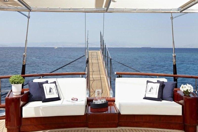 a room with a bed and a large body of water aboard IRAKLIS L Yacht for Charter