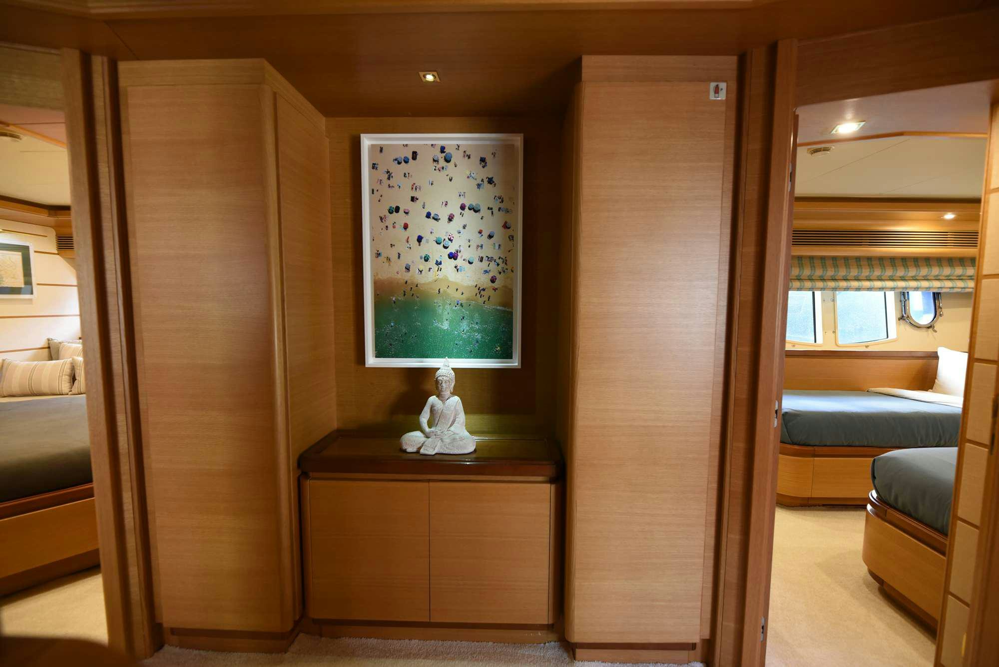 a room with a painting on the wall aboard PAREAKKI Yacht for Charter