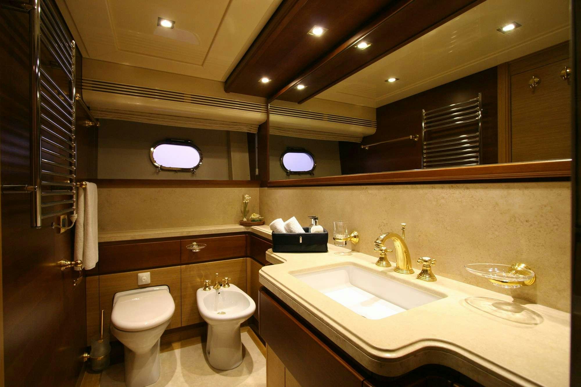 a bathroom with a toilet and sink aboard PAREAKKI Yacht for Charter