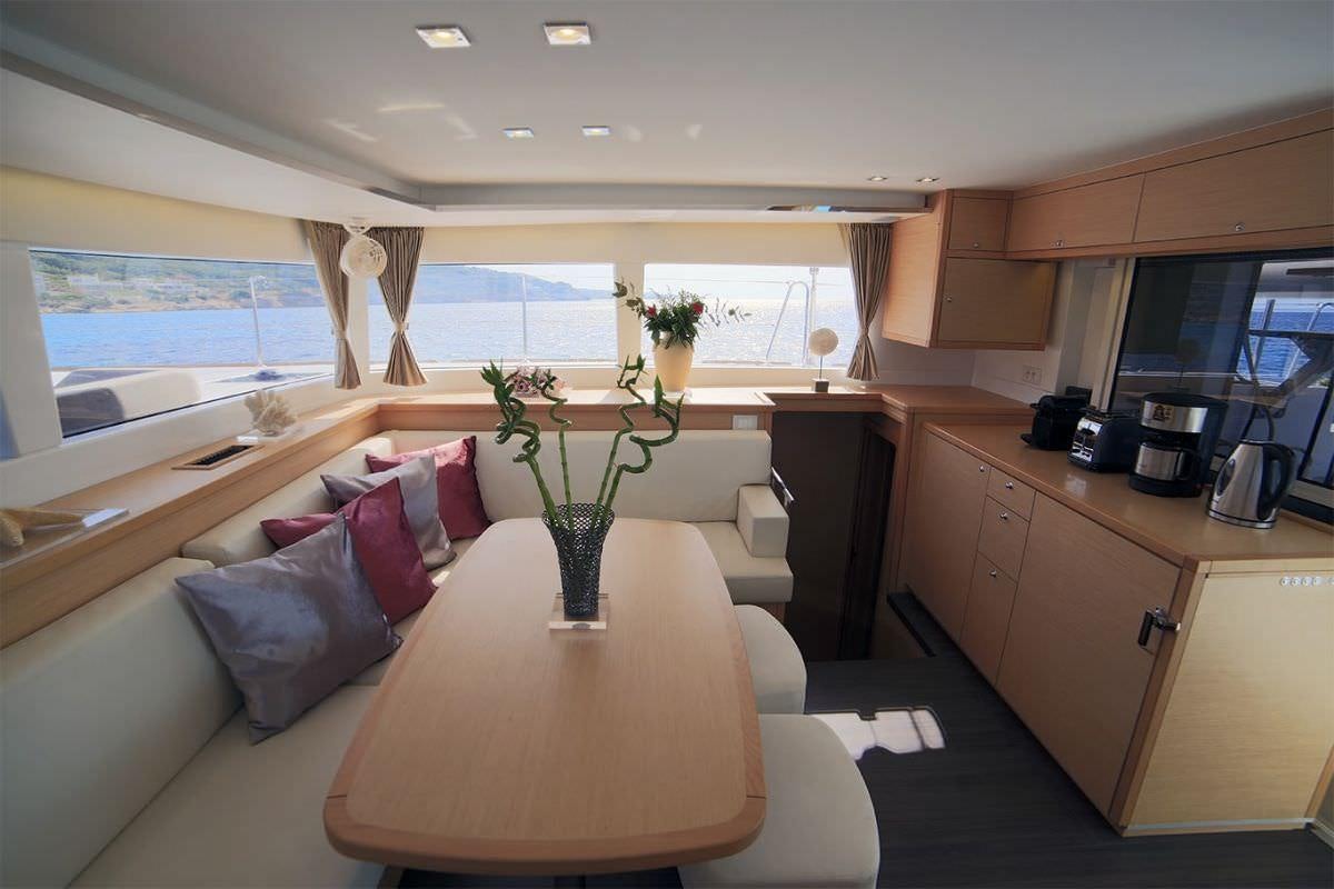 a living room with a couch and a table aboard DANIELA II Yacht for Charter
